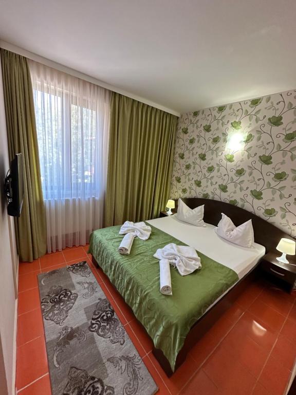 Postel nebo postele na pokoji v ubytování Hotel Turist