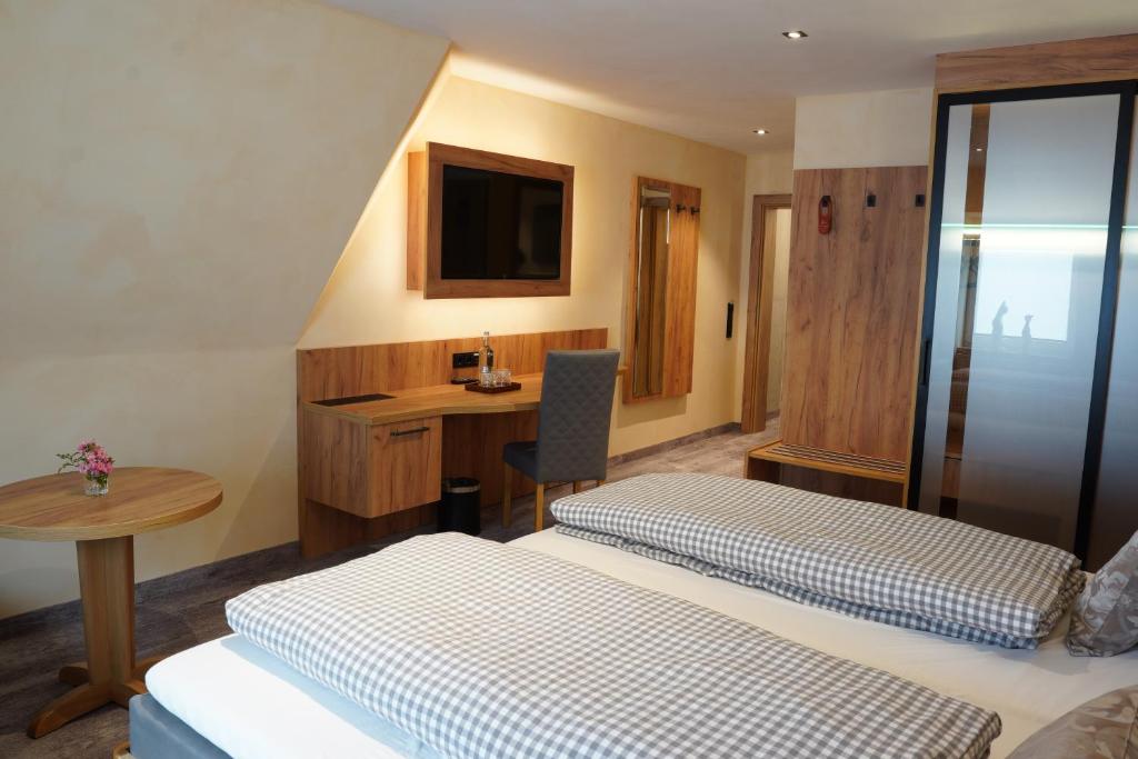 Postel nebo postele na pokoji v ubytování Hotel Heideparadies