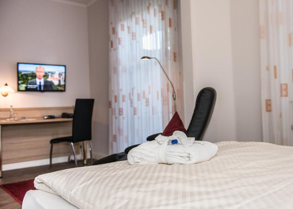 Postel nebo postele na pokoji v ubytování Hotel Pieper-Kersten