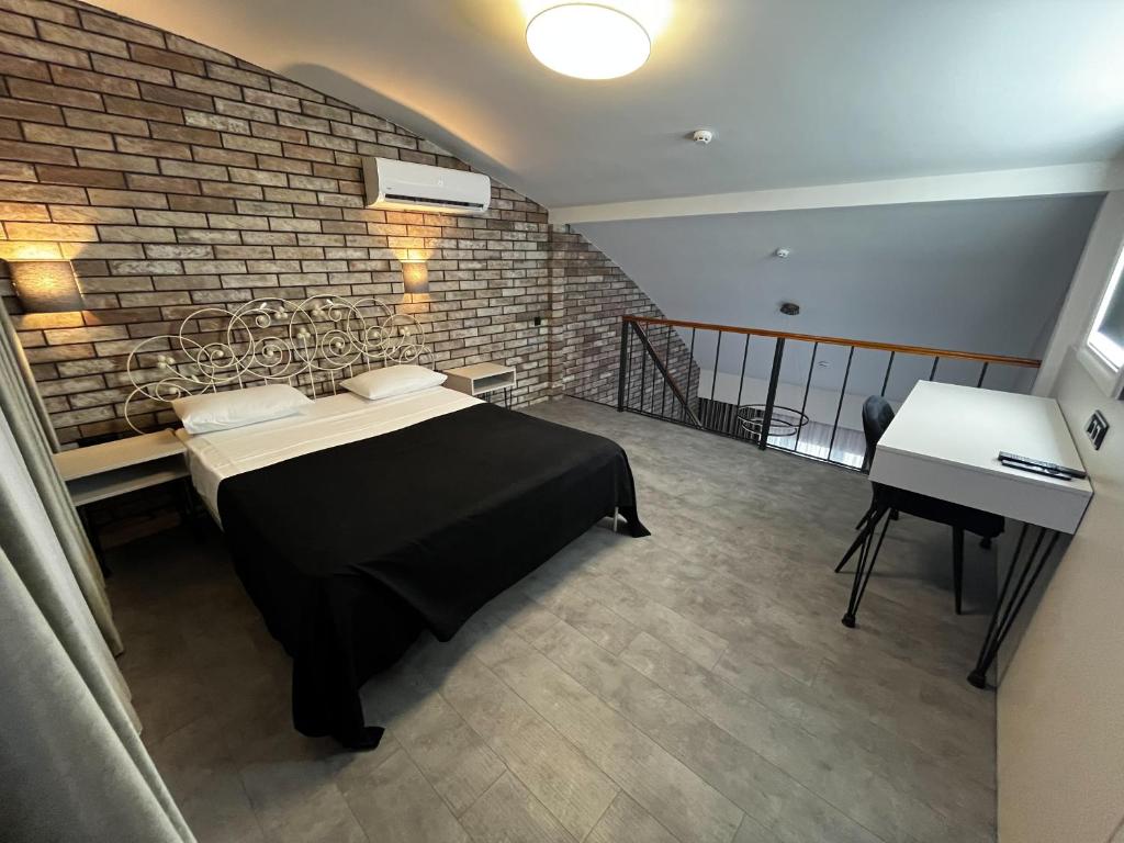Postel nebo postele na pokoji v ubytování Komilfo Hotel