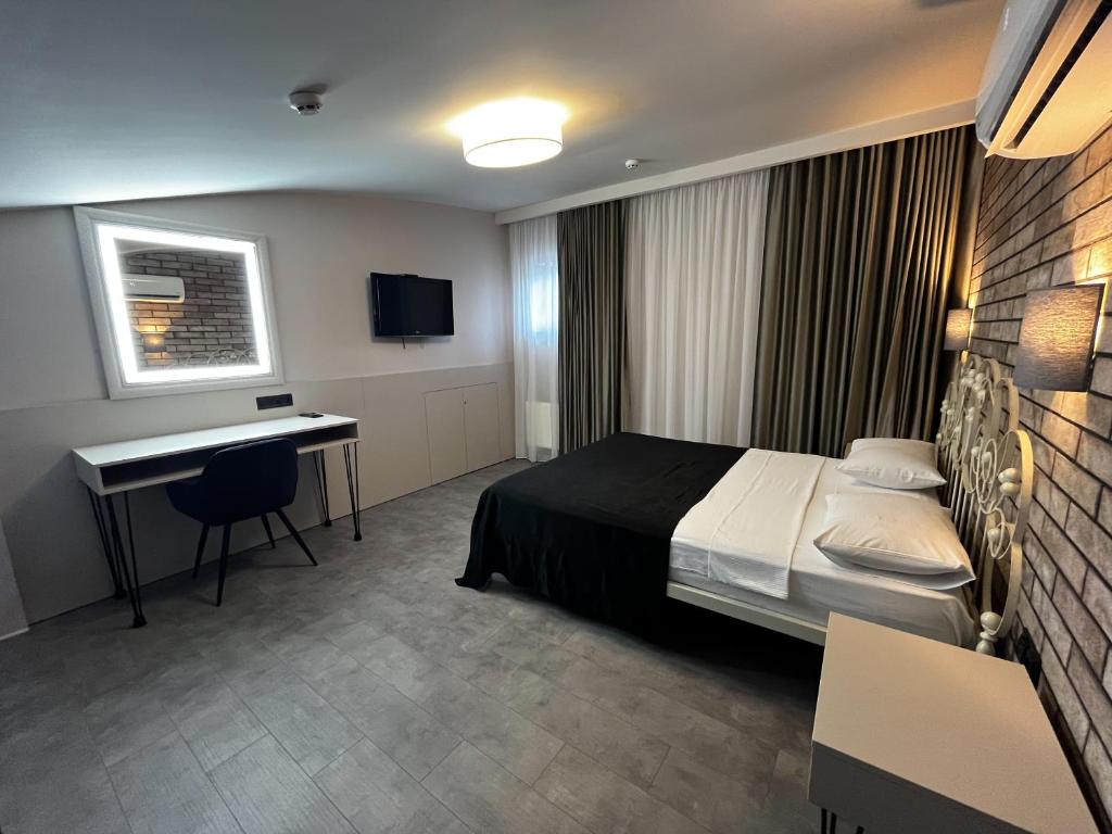 Postel nebo postele na pokoji v ubytování Komilfo Hotel