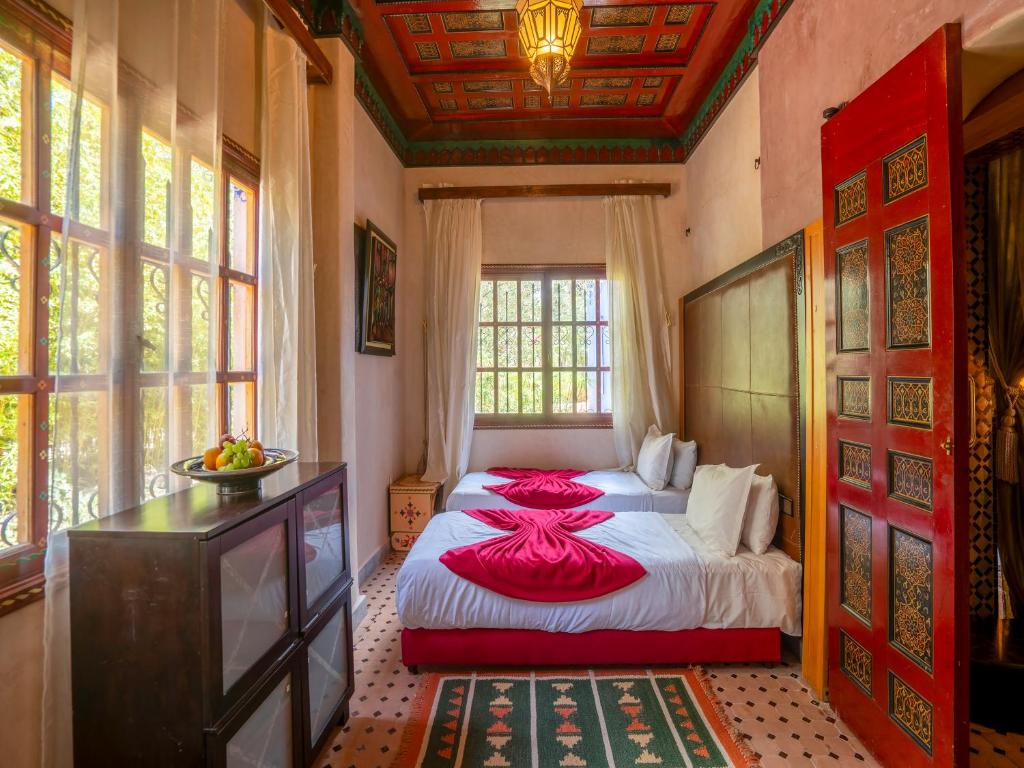 Postel nebo postele na pokoji v ubytování Clé De Sol Riad & SPA