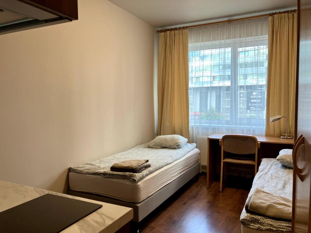 Postel nebo postele na pokoji v ubytování RVR Smart Apartments Riga with self Check-in