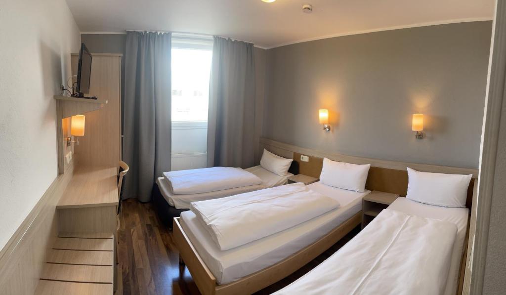 Postel nebo postele na pokoji v ubytování Hotel Imperial