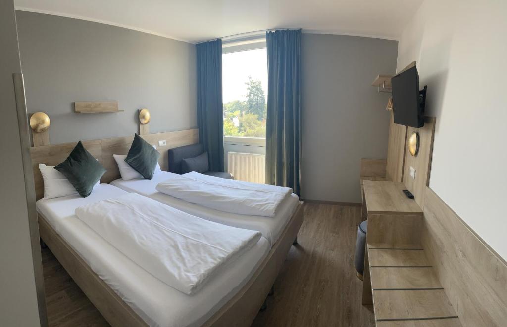Postel nebo postele na pokoji v ubytování Hotel Imperial