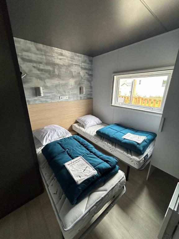 Postel nebo postele na pokoji v ubytování Camping Pen Guen