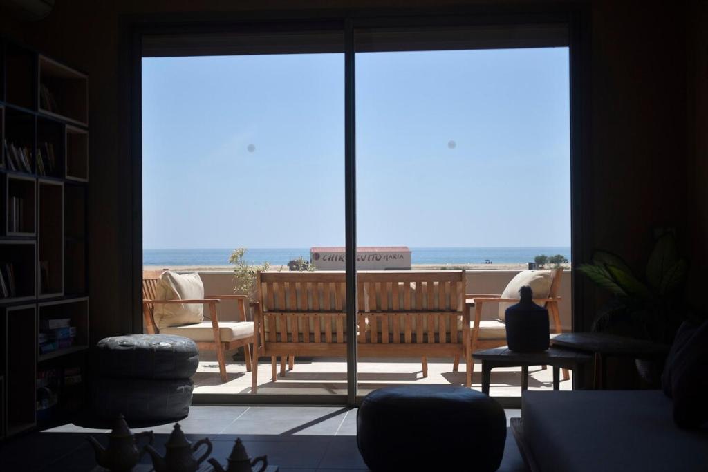 a living room with a view of the ocean at Immi in Agadir