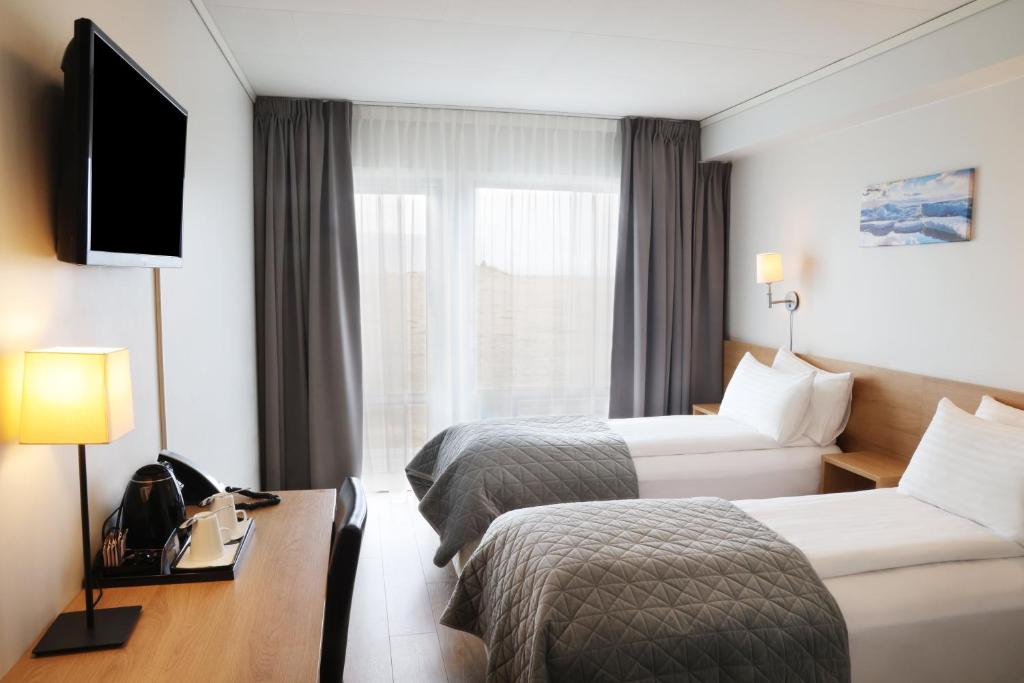 TV a/nebo společenská místnost v ubytování Fosshotel Nupar