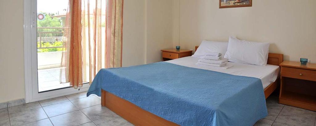 Postel nebo postele na pokoji v ubytování Agapi Apartments