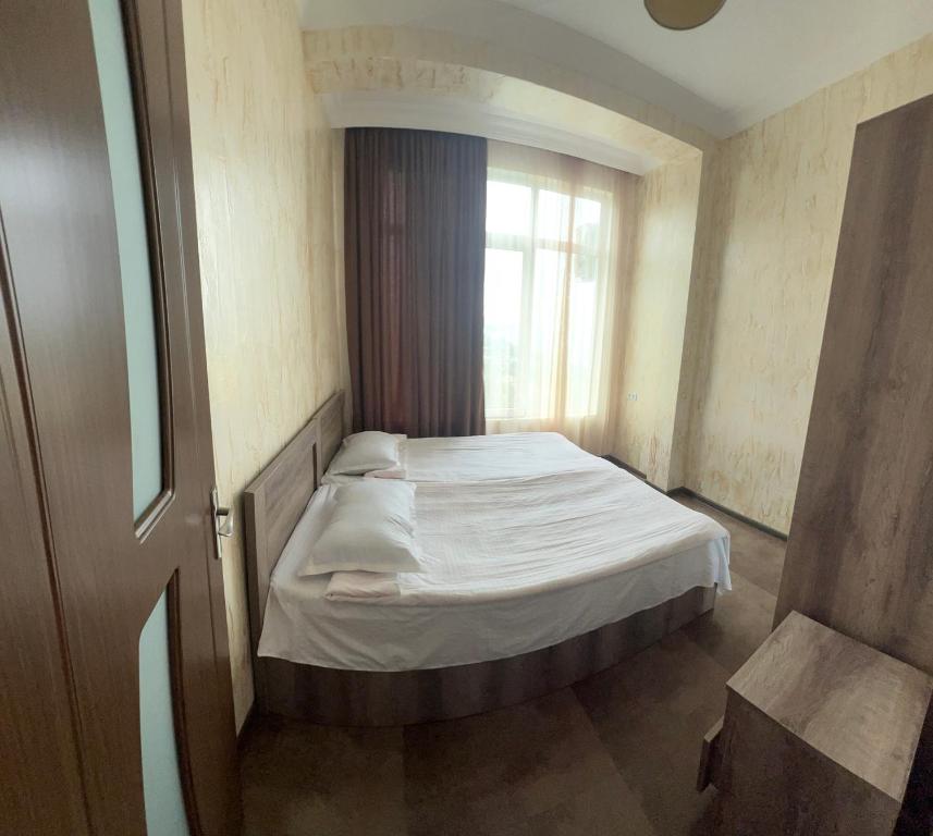 Postel nebo postele na pokoji v ubytování Inn David