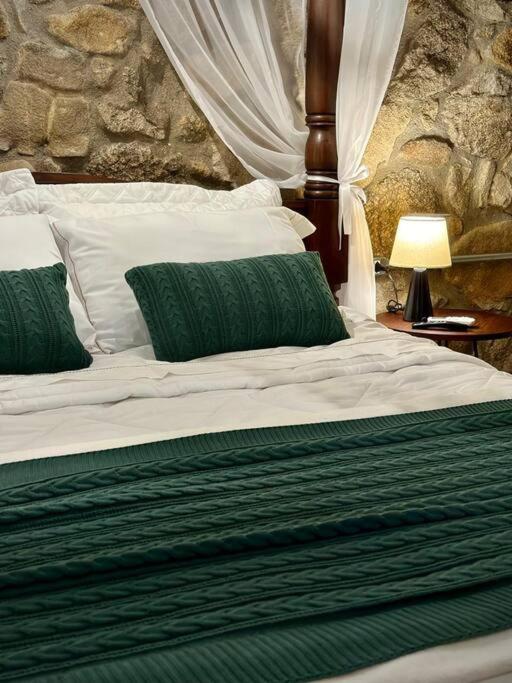 Postel nebo postele na pokoji v ubytování Quarto dos Vinhos