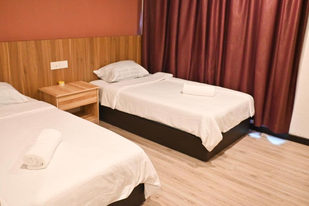 Postel nebo postele na pokoji v ubytování New YX oasis hotel 新悦喜雅居自助酒店