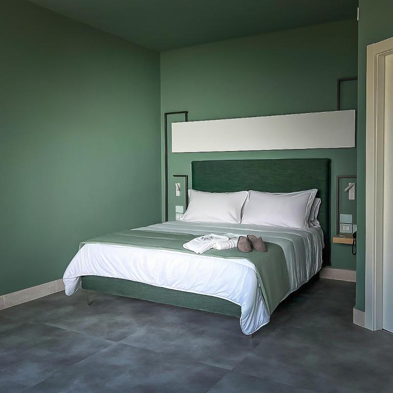 Postel nebo postele na pokoji v ubytování Maiorano Boutique Hotel