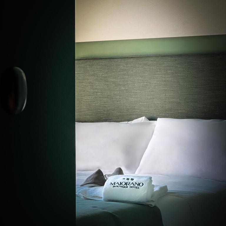Postel nebo postele na pokoji v ubytování Maiorano Boutique Hotel