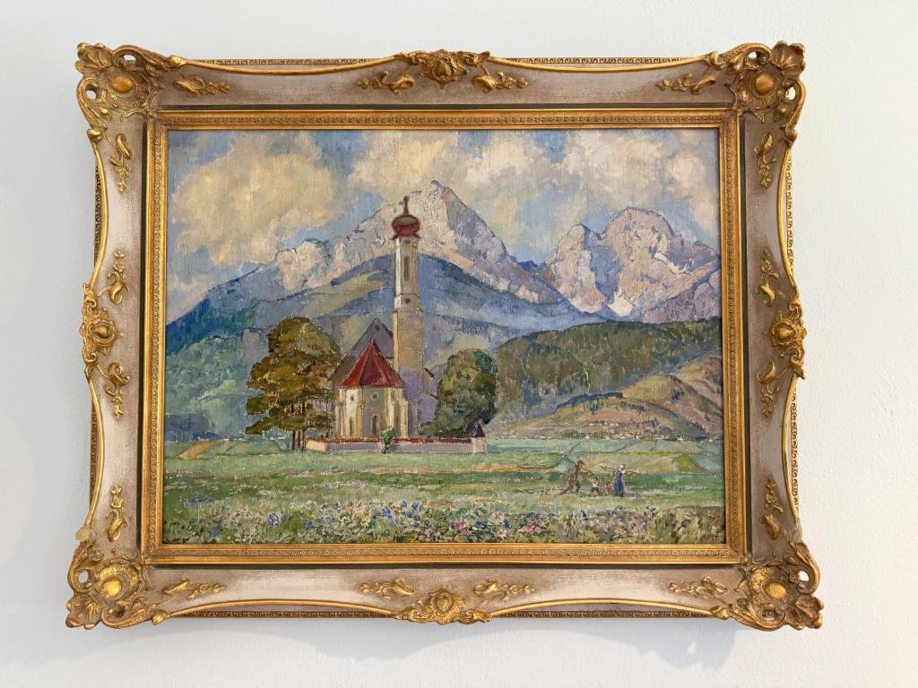 a painting of a lighthouse in a field at Villa Fantasia Budget Boutique Hotel in Füssen