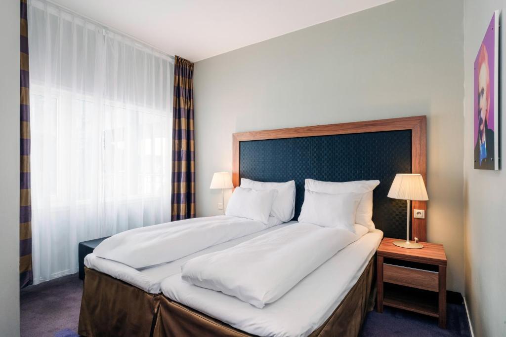 Postel nebo postele na pokoji v ubytování Quality Hotel Edvard Grieg