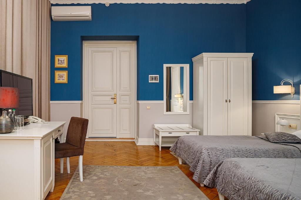 Postel nebo postele na pokoji v ubytování Modern Art Hotel