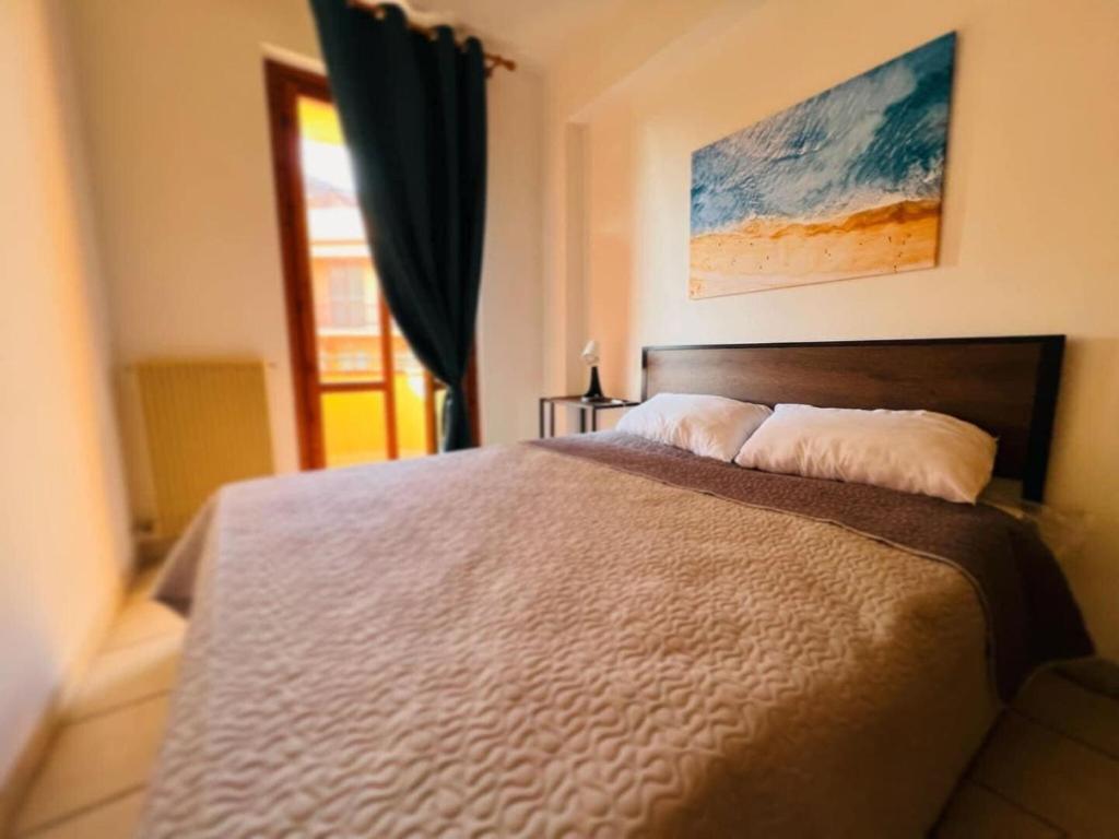 Łóżko lub łóżka w pokoju w obiekcie Italian Experience-Numana Suite Apartment