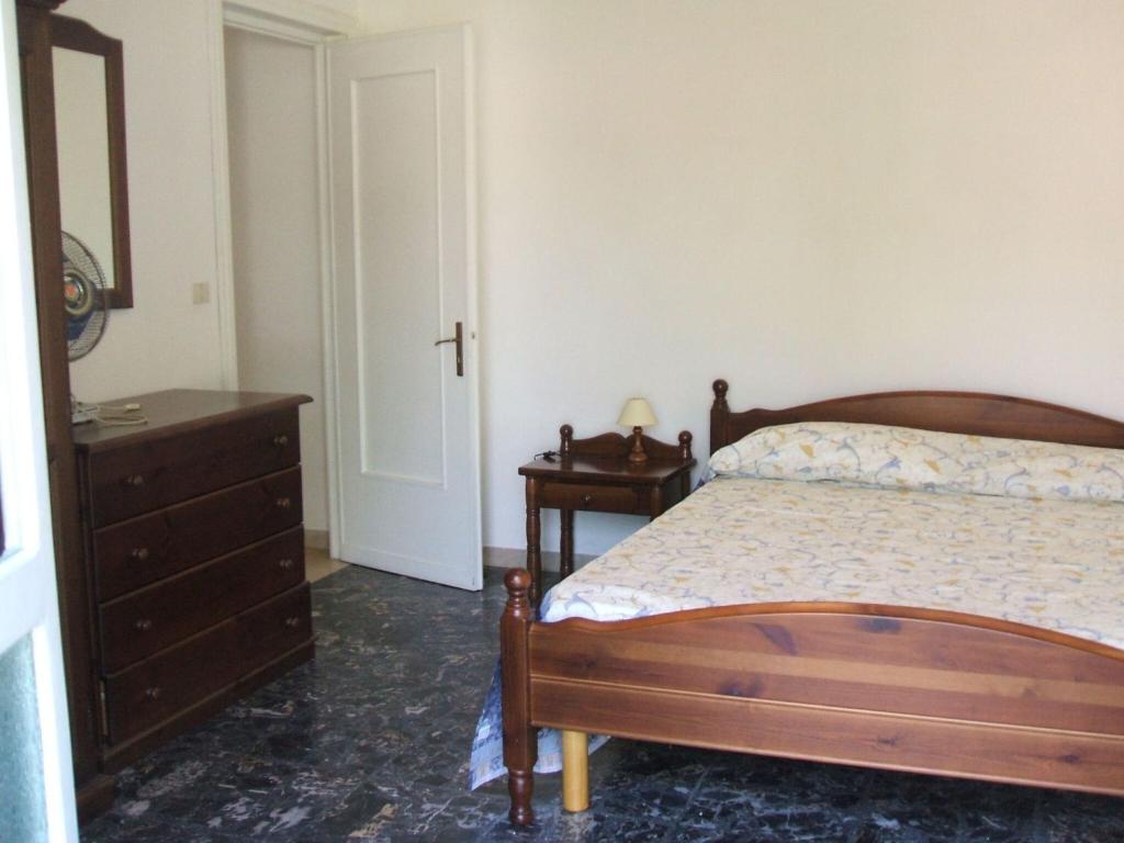 Łóżko lub łóżka w pokoju w obiekcie Italian Experience-Casa Argentario