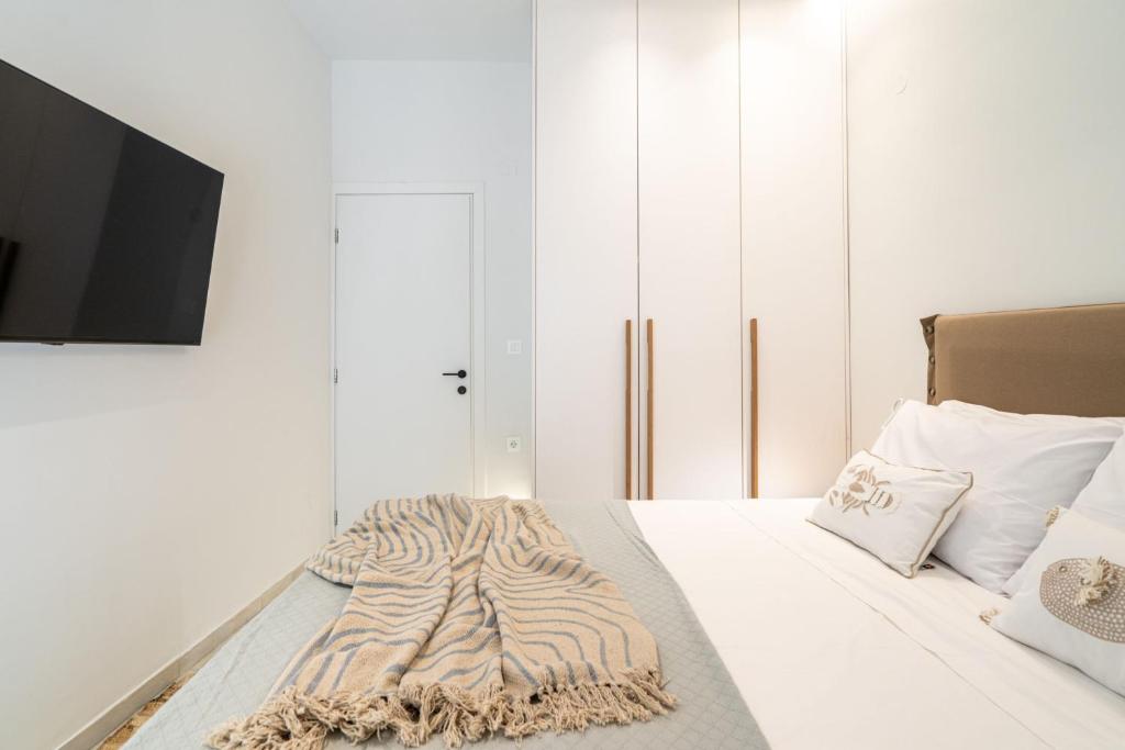 Postel nebo postele na pokoji v ubytování Inia Apartments