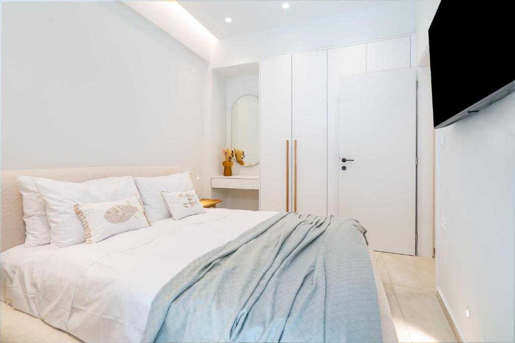 Postel nebo postele na pokoji v ubytování Inia Apartments