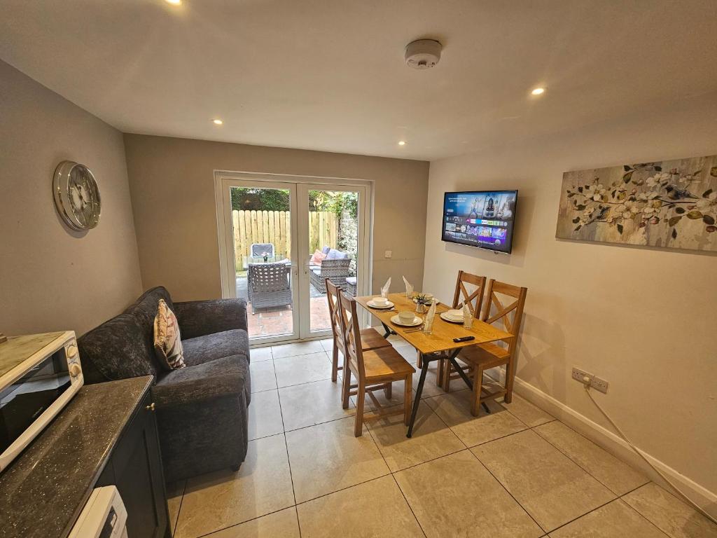 a living room with a table and a couch at 7 Eyre Square Lane in Galway