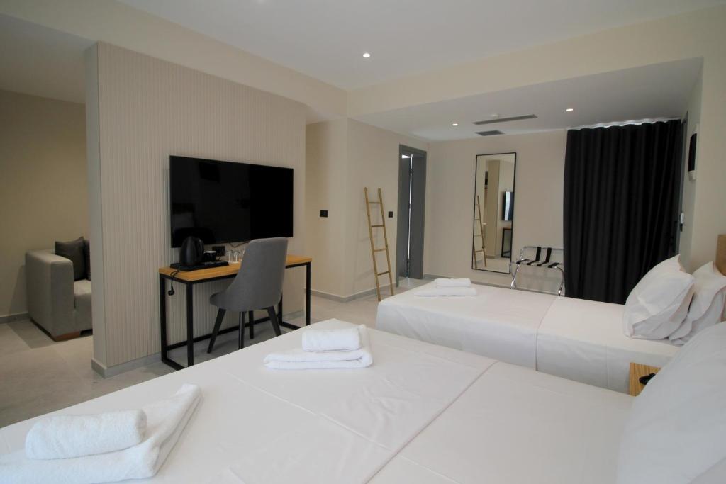 Postel nebo postele na pokoji v ubytování Niklas Boutique Hotel