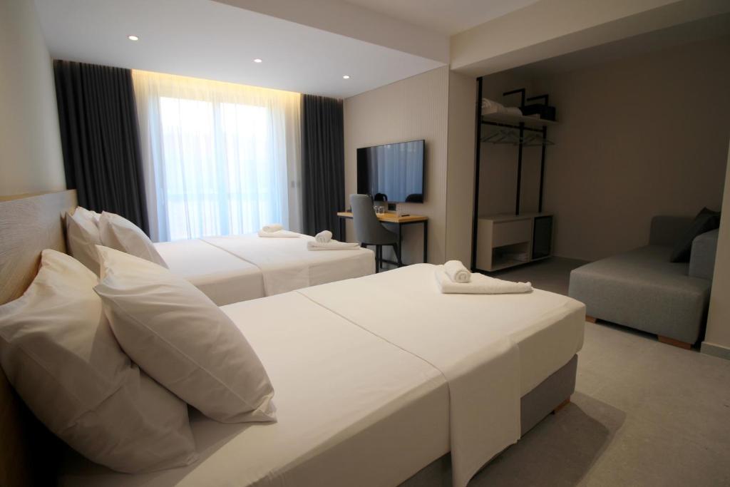 Postel nebo postele na pokoji v ubytování Niklas Boutique Hotel
