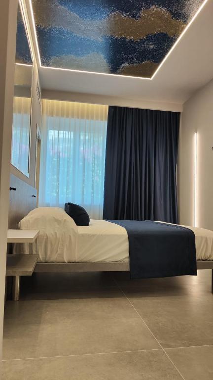 Postel nebo postele na pokoji v ubytování Shanti Rooms & Apartments Lucullo