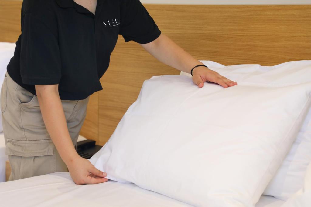 Postel nebo postele na pokoji v ubytování Niklas Boutique Hotel