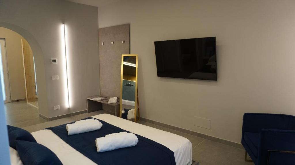 Postel nebo postele na pokoji v ubytování Shanti Rooms & Apartments Lucullo