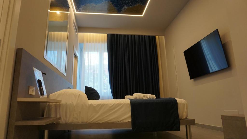 TV a/nebo společenská místnost v ubytování Shanti Rooms & Apartments Lucullo