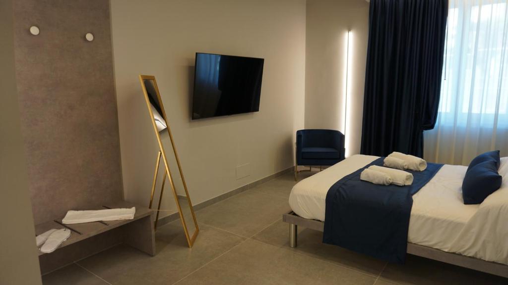 Postel nebo postele na pokoji v ubytování Shanti Rooms & Apartments Lucullo