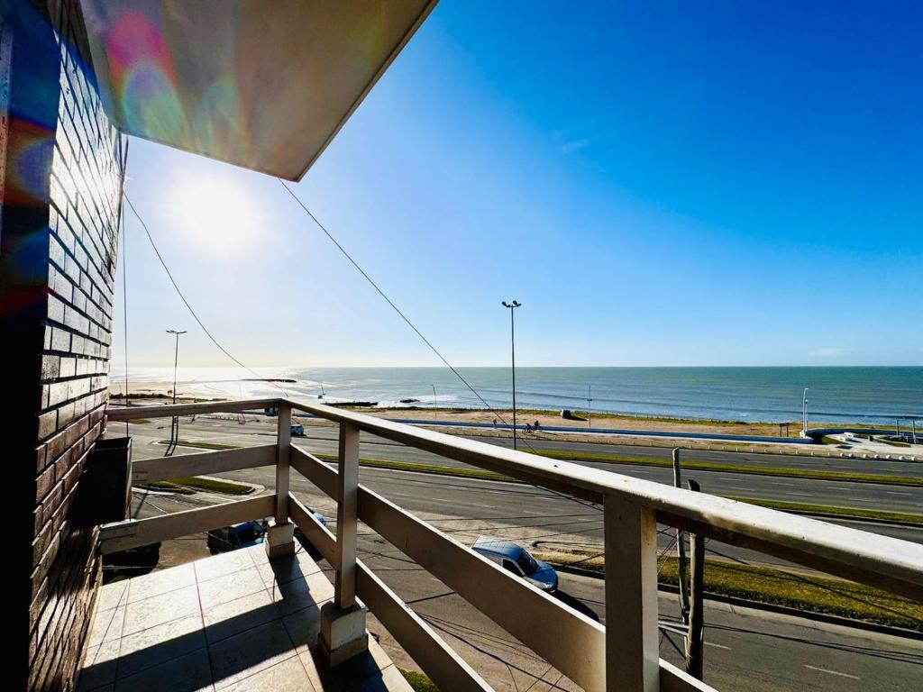 a view of the ocean from the balcony of a building at Departamento A Mar in Mar del Plata