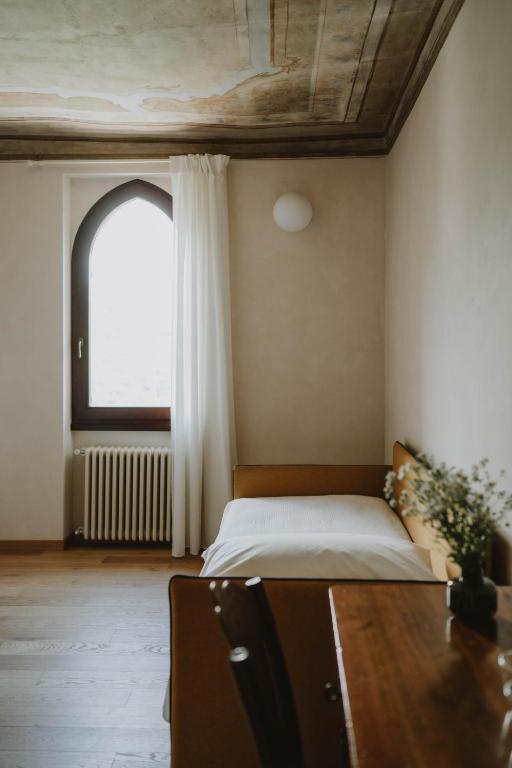 Postel nebo postele na pokoji v ubytování Corte Cavolo