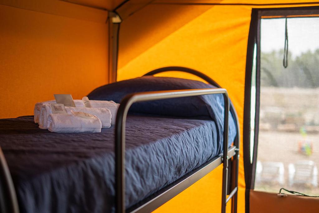 Postel nebo postele na pokoji v ubytování AgriGlamping Munai