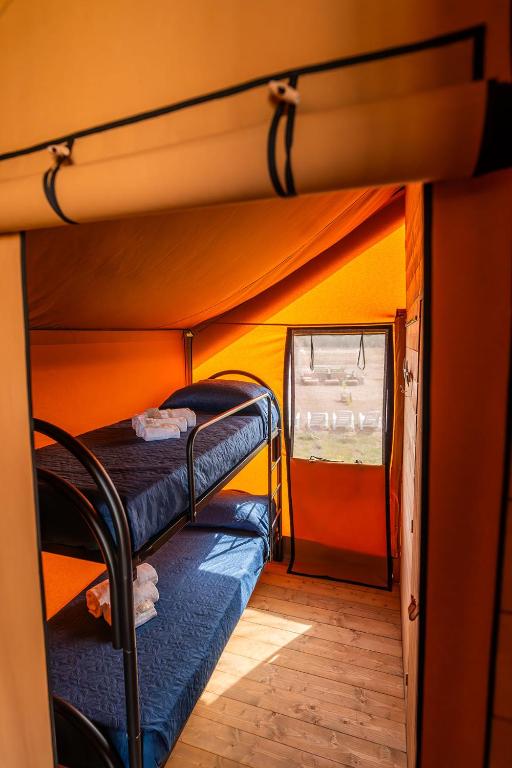 Postel nebo postele na pokoji v ubytování AgriGlamping Munai