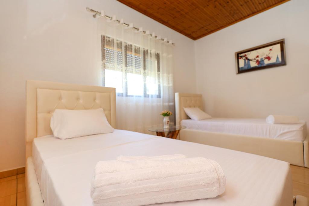 Postel nebo postele na pokoji v ubytování Villa Kevin
