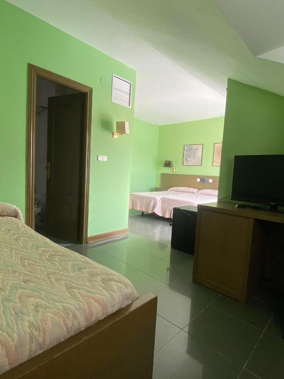Posteľ alebo postele v izbe v ubytovaní Hotel Zenit Mar