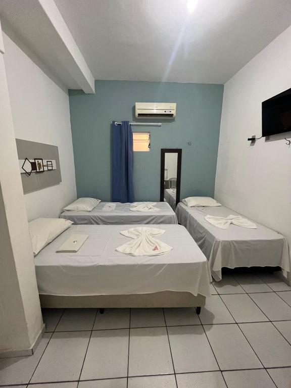 Postel nebo postele na pokoji v ubytování Pousada Executiva
