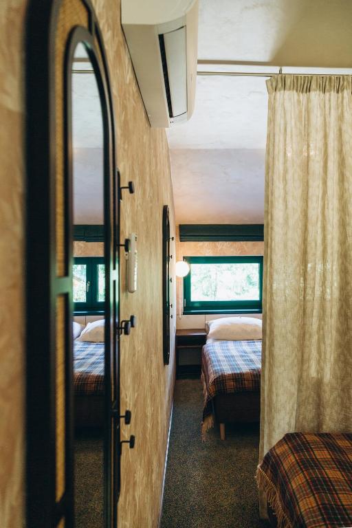 Postel nebo postele na pokoji v ubytování Hotel Vodník