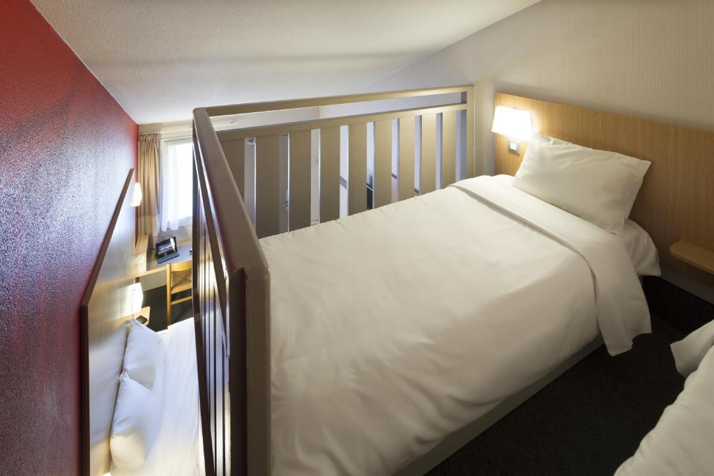 Postel nebo postele na pokoji v ubytování B&B HOTEL Dijon Marsannay
