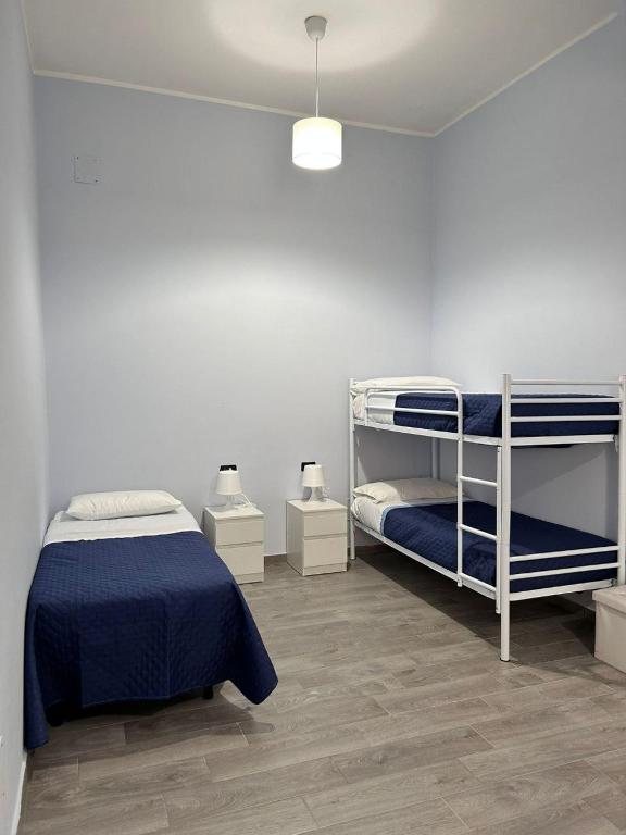 Postel nebo postele na pokoji v ubytování B&B Metropolitan RC