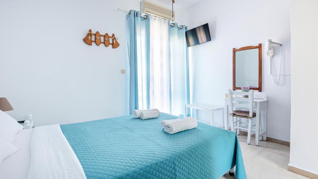 Postel nebo postele na pokoji v ubytování Melissani hotel