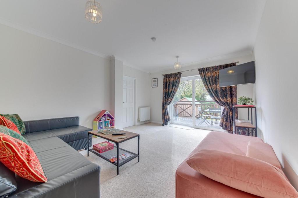 a living room with a couch and a table at 2BR Detached Bungalow with Parking in Stannington