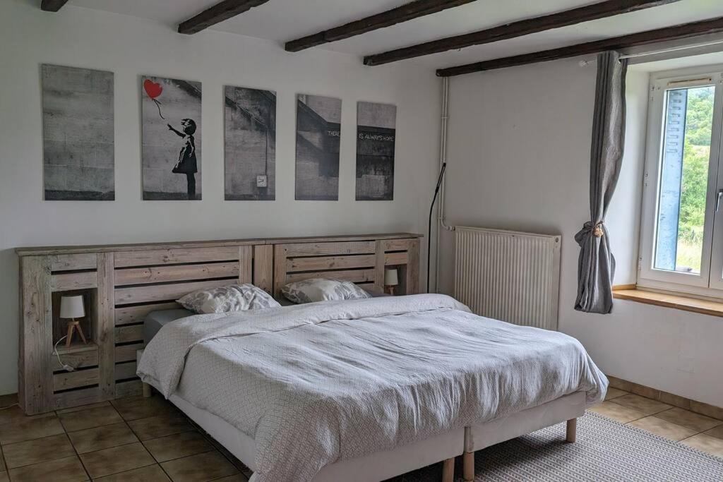 Postel nebo postele na pokoji v ubytování La maison de Gaomi