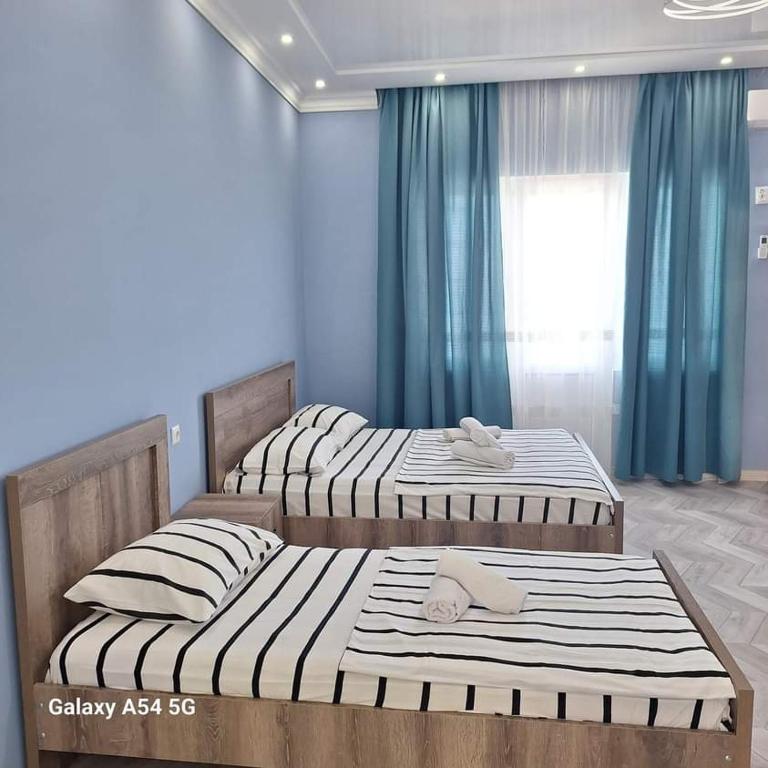Postel nebo postele na pokoji v ubytování David Guest House