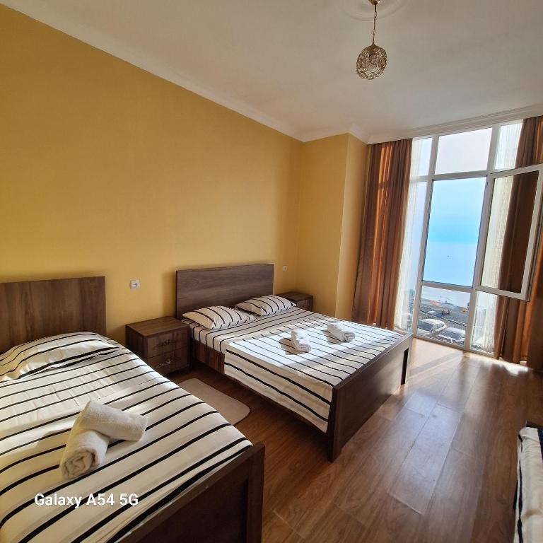 Postel nebo postele na pokoji v ubytování David Guest House