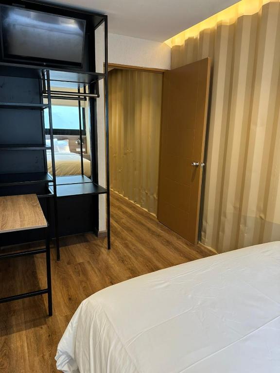 Postel nebo postele na pokoji v ubytování Nomada Republic Hotel Panama City