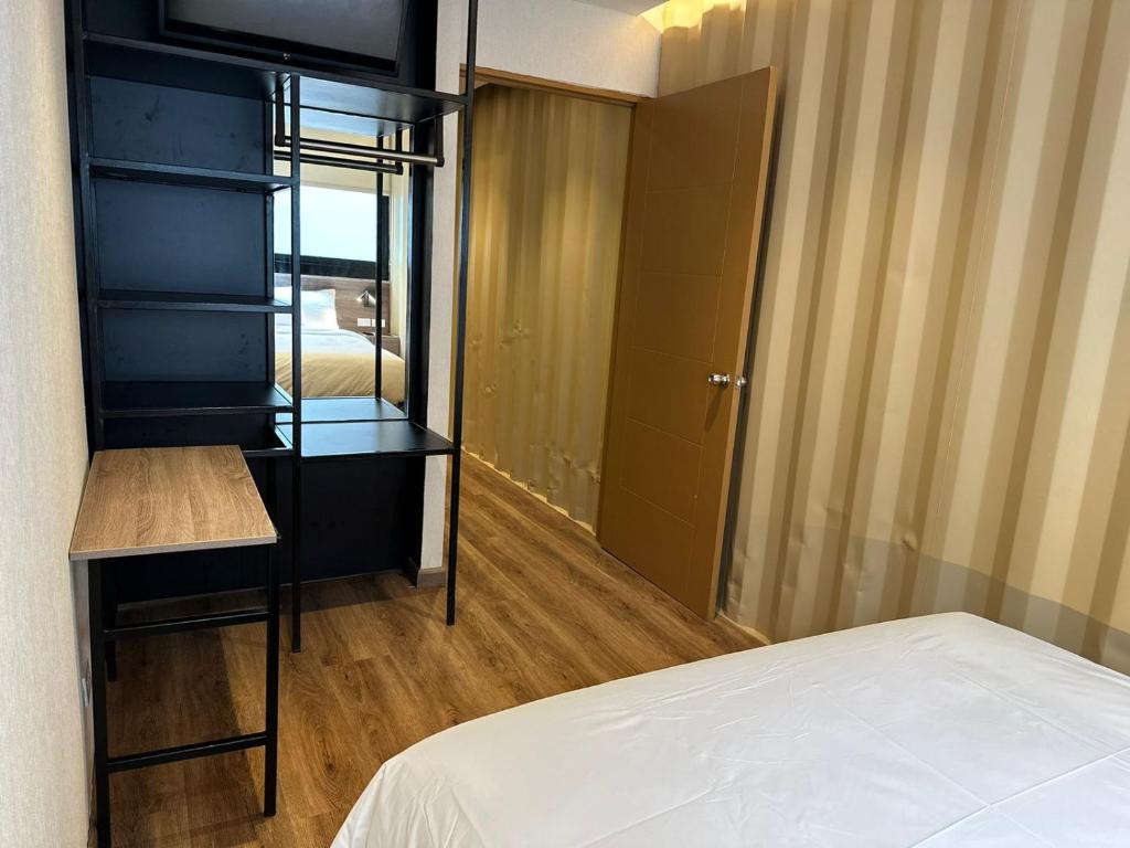 Postel nebo postele na pokoji v ubytování Nomada Republic Hotel Panama City